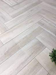We Just Can T Get Enough Of Our Aequa Series Here S An Awesome Install Of Aequa Nix 8x32 In A Herringbone Flooring Ceramic Tile Floor Kitchen Wood Look Tile