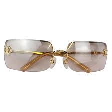 Whether you prefer classic or contemporary frames, each pair is flawlessly designed to lift any look. Chanel Light Brown Gold Crystal Cc Color Tinted Rimless Kylie Sunglasses For Sale At 1stdibs