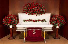 Bright floral display of assorted seasonal flowers in pinks, yellows, white and blue. The Symbolic Meanings Of Funeral Flowers In 2019 Kremp Florist Blog