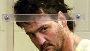 Suspect held in family slayings