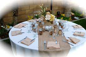 Wedding Tables Ivory Table Cloths With Burlap Runners And Center Pieces Made By The Bride Burlap Wedding Table Burlap Table Runners Rustic Table Runners