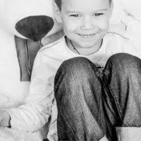 Noah Waterman rides a horse while his father Morgan