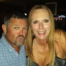 What could be causing slimy oil around the strainer in my John Deere 110  tractor?