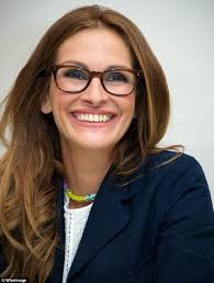 11-year-old Julia Roberts smiles bravely as she stands in front of her  'despised' step-father