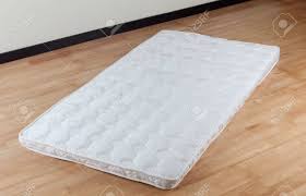 A heated mattress pad is a special mattress pad with a heating device placed under the bed sheet. A Thin Mattress On Wooden Floor Stock Photo Picture And Royalty Free Image Image 21926792