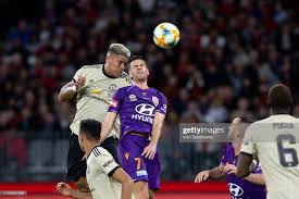 Manchester United Defender Marcos Rojo Wins A Header From Perth Glory Manchester United Manchester International Soccer