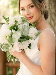 Tons of bud vases with all different blue and white flowers. We loved doing  the flowers for these tables! #taylordevents @adrianaklas