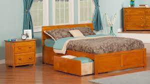The bed is a platform bed, but the platform is a bookshelf which is wider than the bed itself. Wrington Storage Platform Bed Atlantic Furniture Furniture Bed With Drawers