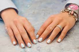 Maybe you would like to learn more about one of these? Female Nails With Beautiful Manicure On The Table In Beauty Salon Pastel Blue And Silver Glitter Design Close Up No Face Beauty Care Stock Photo Picture And Royalty Free Image Image 98236658