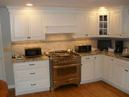 We love the idea of painting the interior cabinets a color that corresponds with an accent piece in the room, like this orange cabinet designed by arent & pyke to match the carpet—what a fun surprise! Kitchen Cabinets Installation Remodeling Company Syracuse Cny