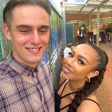 White cat has just been clipped by a car