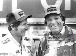 Dale Earnhardt celebrates with crew chief Jake Elder in Victory Lane...  News Photo