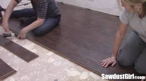 Laying a new floor is a great way to upgrade a room and increase the value of your home. Pergo Installation Laminate Flooring Sawdust Girl