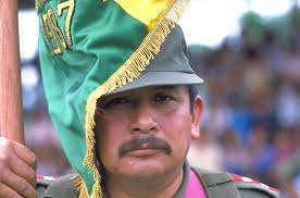Servicemen with Bolivian flag during closing ceremonies of the joint  Bolivia/U.S. exercise Fuerzas Unidas