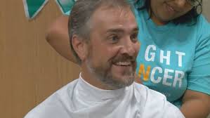 Video: Local cancer patients shave oncologist's head
