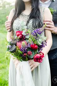 Maybe you would like to learn more about one of these? Wedding Bouquet With Green Red And Violet Flowers And White Stock Photo Picture And Royalty Free Image Image 97470987
