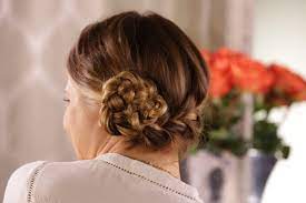 Learn how to braid hair into this chic simple updo with this ghd technique video and master the knotted braid. Cinnamon Roll Braided Updo How To More