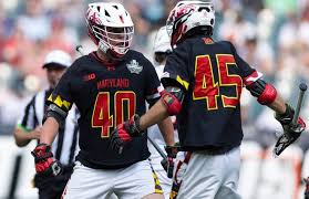 Penn State lacrosse players celebrating a goal