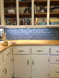 White also reflects more light than other colors, so kitchens with white cabinetry feel light and never dim. Wall Color Help For White Cabinets Blue Backsplash Lots Of Wood