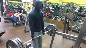 Shoulder shrug 315 pounds for 15 reps with straps