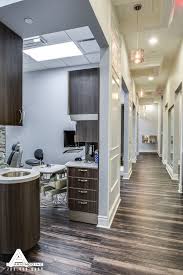 Paneled Hallways And Organic Light Fixtures Dental Office Design By Arminco Inc Dentist Office Design Dental Office Design Medical Office Design