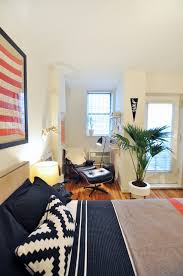 Room dividers can help to separate a newly converted bedroom from the main living area in an open floor plan, such as in a studio apartment. Living With Your Parents How To Turn Your Room Into A Mini Apartment Apartment Therapy