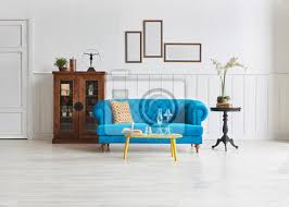 Round black metal wheeled coffee table with teal enamel tray top and tinted glass shelf. Living Room Blue Sofa Yellow Middle Desk And Black Coffee Table Wandsticker Schelf Braun Bequemlichkeit Myloview De