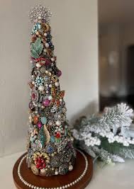 This is your sign not to toss out old and/or broken jewelry. I just  finished this tree I made from some old jewelry that belonged to my mom,  grandmother and great-grandmother...as well