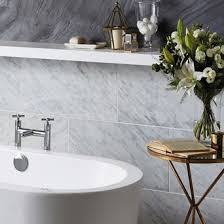Marble can also be found topping the double vanity and set in a herringbone pattern on the shower floor. Marble Tiles For Floors Marble Flooring Topps Tiles