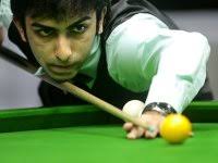 Advani leads the way to last 16