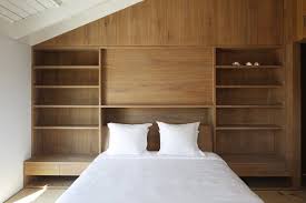 The above bedroom design ideas photo shows a spacious bedroom in creamy yellow tones with with the large number of trees and wood varieties around, there are usually plenty of choices in modern bedroom with dark hardwood floors, plenty of windows, light colored decor and furniture to. Best 60 Modern Bedroom Light Hardwood Floors Wardrobe Design Photos Dwell