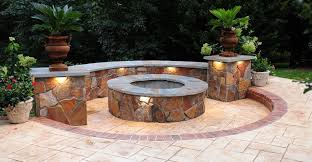 The fire pit converts into an outdoor table when not in use using a wooden topper. Fire Pits Stone Concrete Fire Pit Designs And Ideas The Concrete Network