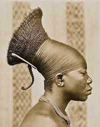 Mangbetu woman photographed in Chief Okondo's village, Congo, May 1913.