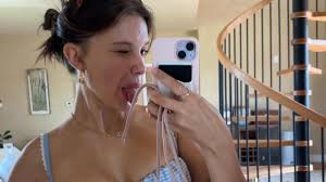 Millie Bobby Brown Poses Cheekily in a Blue Gingham swimsuit Top