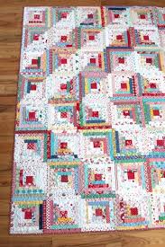 The floral log cabin quilt uses cleverly designed log cabin blocks to create a romantic floral pattern, with large motif fabric filler blocks forming the background. Vintage Inspired Log Cabin Quilt Diary Of A Quilter A Quilt Blog