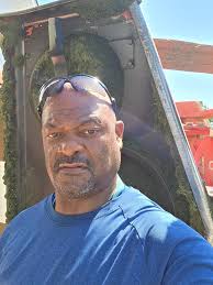 Is standing shoulder press better than sitting?