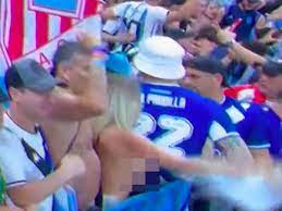 Topless Argentina fan who showed off boobs in stadium faces jail over  reckless stunt - Daily Star