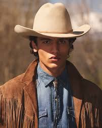 Elements of the #RLPurpleLabel Resort wardrobe. Ralph Lauren styles an  updated iteration of the Hadley blazer—made with cotton terry and  embroidered with a “Ralph's Beach Club” crest—with a striped Polo sweater  and