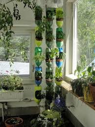 All you need are bottles cut in half, cactus plants or succulents, and many colorful threads to get a really cool decorative effect. 40 Brilliant Plastic Bottle Garden Ideas Vertical Garden Diy Bottle Garden Bottle Garden Ideas
