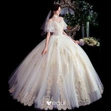 In some cases, it can seem like the bride is floating within a soft cloud of rustling fabric. Best Champagne Outdoor Garden Wedding Dresses 2020 Ball Gown Off The Shoulder Short Sleeve Backless Appliques