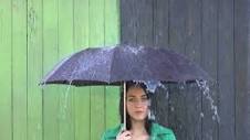 Heavy Rain pours on Girl Sheltered under Umbrella., People Stock ...