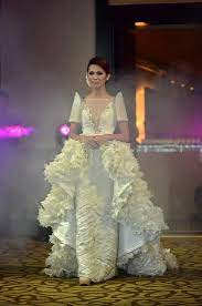 A Terno Wedding Gown With A Beaded Transparent Neckline A Pleated Skirt And A Detachable La Filipiniana Wedding Dress Elegant Wedding Dress Filipiniana Dress