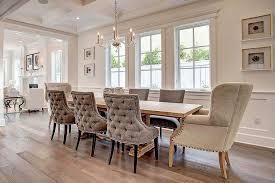 Elegant Dining Room Features A George Ii Chandelier Hung From A Coffered Ceiling Over An Extr Tufted Dining Chairs Transitional Decor Living Room Dining Chairs