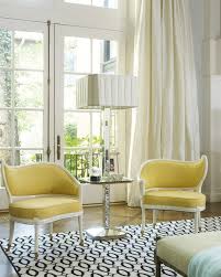 Yellow living room with red accents from the wall arts, armchairs, and pillows that lay on the white sofa. Yellow Accent Chairs Living Room Dining Chairs Design Ideas Dining Room Furniture Reviews