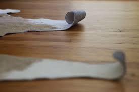 How To Flatten A Curling Cowhide Cow Hide Rug Rugs In Living Room Cowhide Decor