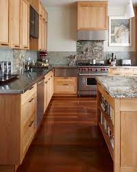 The lead time for cabinetry will vary. Maple Cabinets With Blue Green Tile Backsplash And Gray Well Stainless Steel Countertops And The Floor Eclectic Kitchen Maple Kitchen Cabinets Wood Kitchen