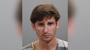 Knoxville man charged with vandalism after swinging from construction  equipment, 'like a stripper'