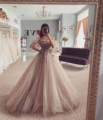 To create such a dramatic look, many ball gown wedding dresses use layers of tulle or crinolines, a type of stiff underskirt. Charming Ball Gown Off The Shoulder Long Sleeves Coffee Wedding Dresses Abw009 In 2021 Gowns Applique Wedding Dress Ball Dresses