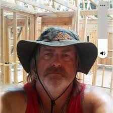 Who is a recommended professional landscaper in Cocke County, TN for stone  laying, flower bed design and building, and water features?