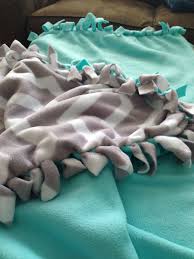 Easy instructions on how to make a no sew stretchy swaddle blanket from 100% cotton stretchy jersey, my favorite material. Pin By Jennifer Holmberg On Sick Ideas Knot Blanket Diy Baby Blanket Tie Blanket Ideas